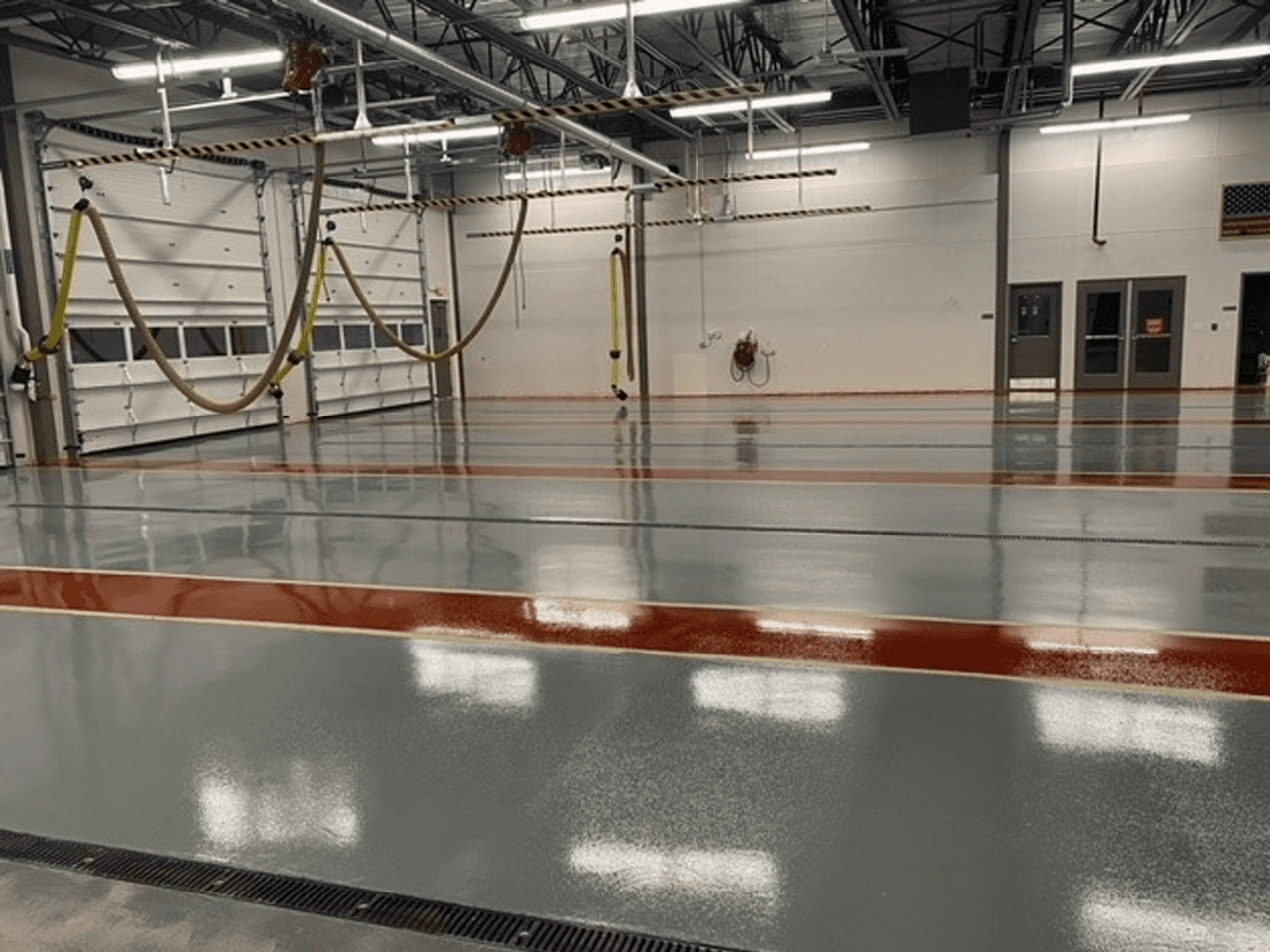 Durable concrete floor coating in automotive service facility